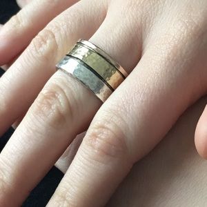 Wide sterling and mixed metal spinner ring.